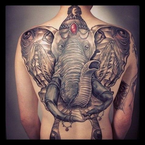 31. The unbelievable idea of an elephant on the back. This unusual presentation of the elephant will surprise the tattoo lovers. The enormous animal in the form of butterfly covers the whole back, which will suit strong and brave men. The work includes some details such as precious stones on its head and tusks.  - source Big Five Tattoo, Whole Back Tattoos Men, Back Tattoos Men, Five Tattoo, Indian Elephant Tattoo, Mantis Tattoo, Elephant Tattoo Meaning, Elephant Tattoo Design, Princess Tattoo