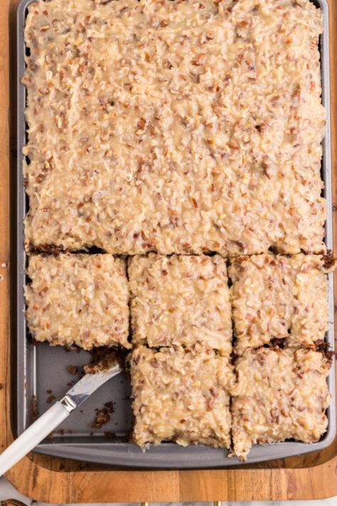 German Chocolate Sheet Cake! An easy German Chocolate sheet cake recipe with a spiffed-up cake mix base and homemade caramel, pecan and coconut icing. German Chocolate Sheet Cake, Chocolate Sheet Cake Recipe, Homemade German Chocolate Cake, Sheet Cake Recipe, Coconut Icing, German Chocolate Cake Mix, German Cake, Chocolate Sheet Cake, Sheet Cake Recipes