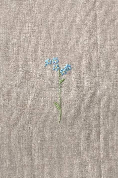 "Handmade Embroidery \"Forget-Me-Not\" Choose this embroidery for any item of our shop: 1. Add any item you would like to get with this embroidery to your basket, 2. Add the name of the item to which you want to add it in the personalisation box, 3. Add this embroidery to your basket. Each piece of handmade embroidery is unique, even when using the same pattern, so you will never find two completely identical pieces, but yet all of them are equally cute and beautiful." Forget Me Not Flowers Embroidery Pattern, Simple Floral Embroidery Designs, Embroidered Forget Me Nots, Embrodery Stiching Flower, Simple Flower Embroidery Pattern, Small Flower Embroidery Designs, Tiny Embroidery Patterns, Simple Embroidery Designs For Beginners, Small Embroidery Flowers