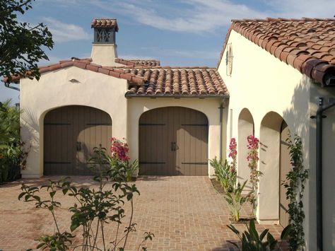 Deciding on a Garage Door | Home Remodeling - Ideas for Basements, Home Theaters & More | HGTV Mission Style Homes, Wood Garage Doors, Garage Door Design, Spanish Style Home, Spanish Style Homes, Spanish Design, Exterior Paint Colors For House, Mediterranean Home, Spanish House