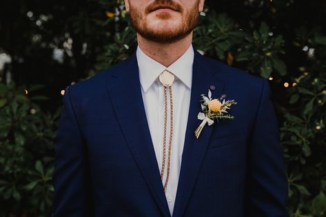 Texas in downtown austin. Allan house. Wedding inspiration. Bolo tie vibes Navy Suit Bolo Tie, Bolo Tie Groomsmen, Wedding Bolo Tie, Bolo Tie Wedding, Schoolhouse Wedding, Blue Tuxedo Wedding, Blue Tuxedos, Groomsmen Ties, Groom Ties