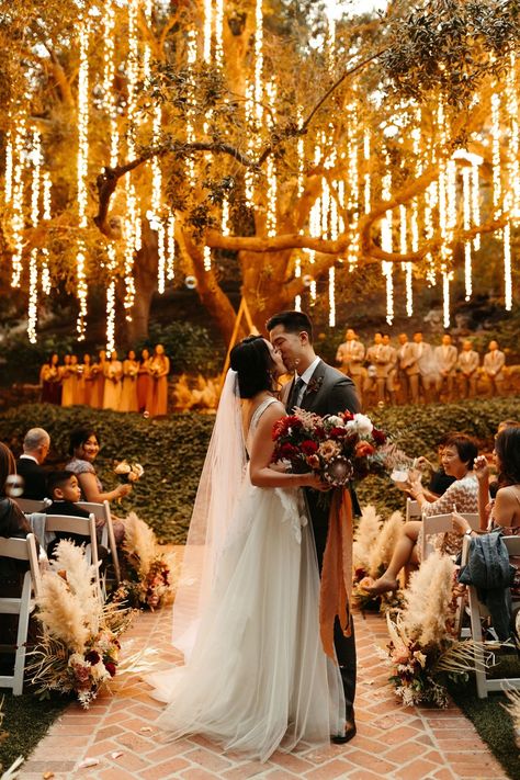 romantic and magical forest wedding ceremony lit up with string fairy lights in the trees #ceremonylights #firstkiss #hanginglights Twilight Wedding, Fairy Lights Wedding, Forest Theme Wedding, Calamigos Ranch, Enchanted Forest Wedding, Fairy Wedding, Future Wedding Plans, Outdoor Wedding Decorations, Whimsical Wedding