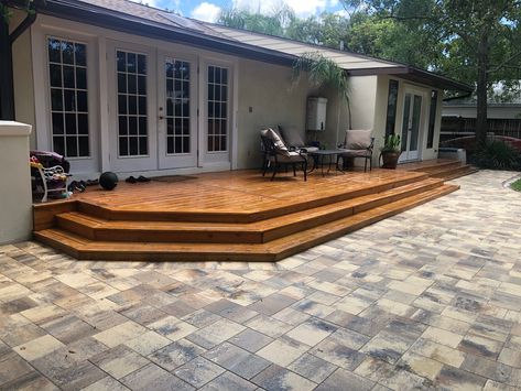 This home had an existing wood deck.  We installed a brick paver patio to add additional seating and entertaining area. Wood And Paver Patio, Deck Paver Patio Combo, Pavers And Wood Deck, Concrete Patio With Wood Deck, Deck Concrete Patio Combo, Deck Connected To Patio, Wood Deck And Concrete Patio Combo, Deck And Paver Patio Combo, Porch To Patio Transition