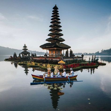 Ulun Danu Beratan Temple, located in central Bali, is a significant water temple integral to the island's irrigation system, particularly overseeing the water drawn from Lake Batur. The temple's origins date back to 1556, and it was notably rebuilt in 1633 by the King of Mengwi, I Gusti Agung Putu, incorporating both Hindu and Buddhist architectural elements. Despite its historical age, the temple is well-preserved and maintained by the local community, and it stands as one of Bali's most i... Bali Water Temple, Temple Bali, Uluwatu Temple, Water Temple, Water Drawing, Local Community, Irrigation System, The Temple, Architectural Elements