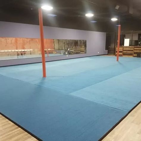 blue carpet topped roll out mats installed in martial arts studio Cheer Gym Ideas, Gymnastics Mats For Home, Cheer Mats, Cheer Gym, Martial Arts Mats, Crazy Faith, Gymnastics Mat, Playground Flooring, Indoor Play Areas