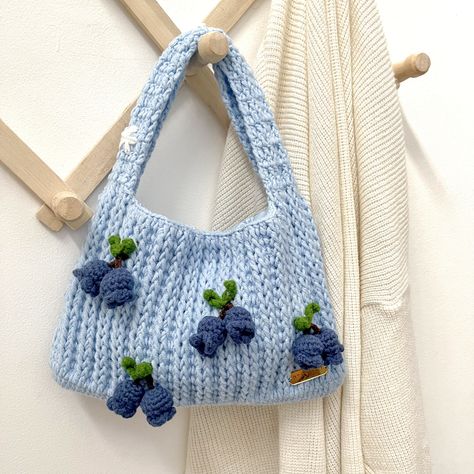 Blueberry Crochet Handbag with Daisy🫐 This crochet bag is small and minimalist but you can put a lot of things in it!  The basic color is blue combined with small blueberries plushie, making it even cuter, and you can really use it when taking photos while traveling. OH and also, on the handle of the bag there are 3 daisy flowers which make this bag even more unique and cute! -- YOU CAN'T FIND IT ANYWHERE ELSE! -- 🌿Size approximately :       - Width = 23,5 cm      - Length (without strap) = 15 cm 🌿Strap length : +- 23 cm 🌿This crochet bag is made with natural cotton 🌿What will you get when purchase this lovely crochet bag? -The crochet bag -BONUS : mini mirror and more🤩 -You will get the right procedure for washing crochet, so that the product can last longer ⛔️NOTE = This item is no Crochet Blueberry Bag, Small Crochet Items, Plushie Making, Cute Crochet Purse, Small Crochet Purse, Blueberry Crochet, Blue Crochet Bag, Mini Crochet Bag, Small Crochet Bag