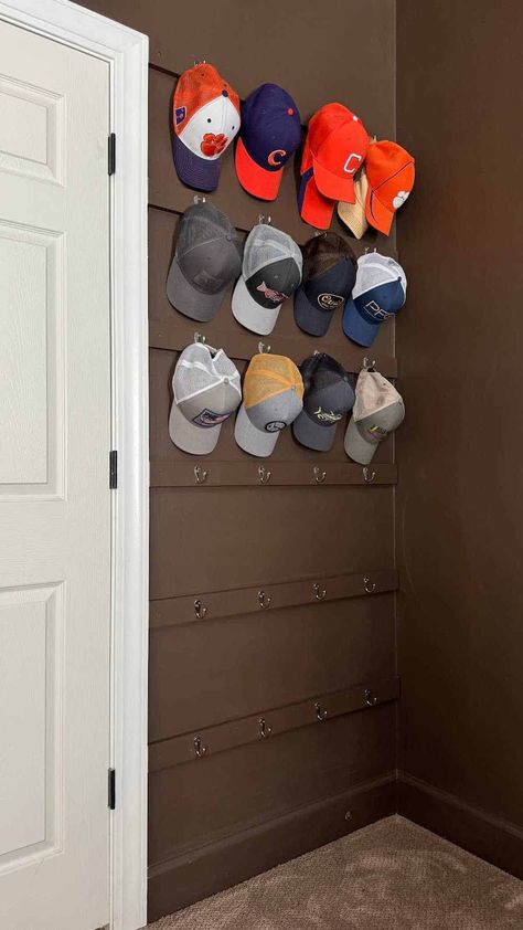 Baseball Hat Wall Organizer Baseball Hat Display Ideas Wall Bedroom, Hat Rack In Closet, Baseball Hat Wall Display Bedrooms, Ball Cap Holder Ideas, Baseball Hat Decorating Ideas, Baseball Cap Organization Ideas, Hat Organizer Ideas, Hats On Wall Bedroom, Hat Storage Ideas Wall