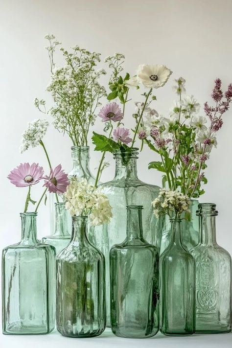 Add a touch of sustainability to your home decor with DIY recycled glass bottle vases! These eco-friendly pieces are easy to make and perfect for any space. 🏡✨ #DIYRecycledDecor #EcoFriendlyVases #UpcycledHomeProjects #GreenLiving #EcoDecor Recycled Decor, Eco Decor, Recycled Glass Bottles, Eco Friendly Decor, Diy Recycle, Bottle Vase, The Trend, Green Living, Recycled Glass