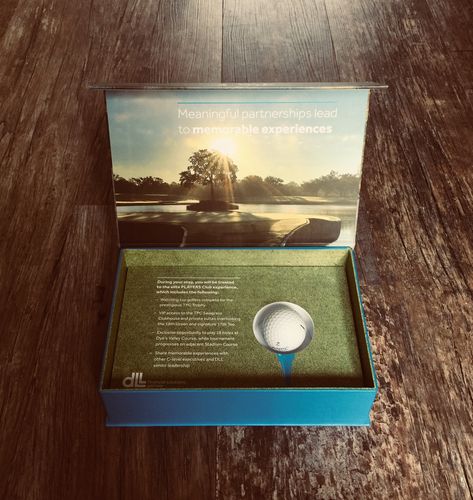 Hole-in-one! This bespoke Presentation Box for DLL hits the spot when it comes to an engaging and memorable creative marketing solution.  Created as a luxury golf experience invitation to a VIP event the recipient can read about the experience ahead and receive a branded golf ball which was set in a bespoke foam fitment.  #Presentationbox #FuseInnovation #DLL #creativemarketing #creativepackaging #creativecommunications #marketingproducts #physicalmarketing #luxuryinvitations #bespokeinvitations Golf Invitation Design, Golf Package Design, Golf Activation, Golf Packaging, Golf Invite, Golf Marketing, Work Event Ideas, Cinema Idea, Golf Theme Party