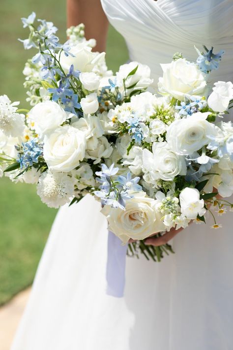 Lake Wedding Florals, Soft Colorful Wedding Flowers, Summer Wedding Dusty Blue, White Florals With Greenery, Oval Table Wedding Centerpieces, Blue And White Tall Centerpiece, Wedding Flowers Hydrangea Bouquet, White Wedding Flowers With Pop Of Blue, Wedding Bouquets Bride Spring