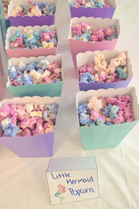 When I first saw this Mermaid Popcorn Recipe, I already knew I'll be making this for my daughter if we decide to throw a Mermaid themed party. The popcorn looks yummy and the pastel color just adds the mermaid vibe. You can make this at home for your little girl's party by simply following the recipe provided. Mermaid Popcorn, Mermaid Birthday Party Food, Mermaid Party Food, Little Mermaid Birthday Party, Ariel Birthday Party, Mermaid Birthday Party Decorations, Mermaid Theme Birthday Party, Ariel Birthday, Moana Party