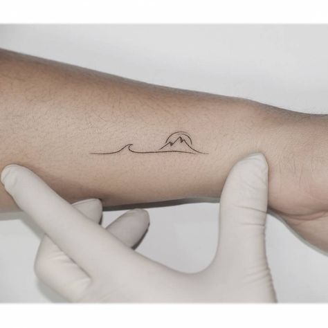 Minimalistic style mountain and wave tattoo located on North Shore Tattoo, Mountain And Wave Tattoo, Mountains And Ocean Tattoo, Tiny Mountain Tattoo, Mountain And Ocean Tattoo, Moutain Tattoos, Simple Wave Tattoo, River Tattoo, Lake Tattoo