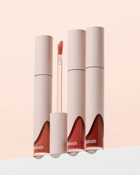 Hydrating Matte Lipstick Heimish’s Dailism Liquid Lipstick comes in three universally flattering shades for a pop of color on your lips. It hydrates and leaves a matte, yet subtly glossy finish. Price reduced! Open by 9/14/2025. Use within 12 months after opening. Great for Skin Types: All Skin TypesSkin Concerns: All, Dryness Why We Love it Heimish’s Dailism Liquid Lipstick provides long-lasting lip color. Its soft-matte, cream-type liquid comes in three shades that are all layerable and non-dr Liquid Lipstick Product Photography, Liquid Lipstick Packaging, Lipstick Packaging Design, Foundation Packaging, Lip Photography, Lipstick Photography, Lipstick Packaging, Lipstick Design, Burning Rose