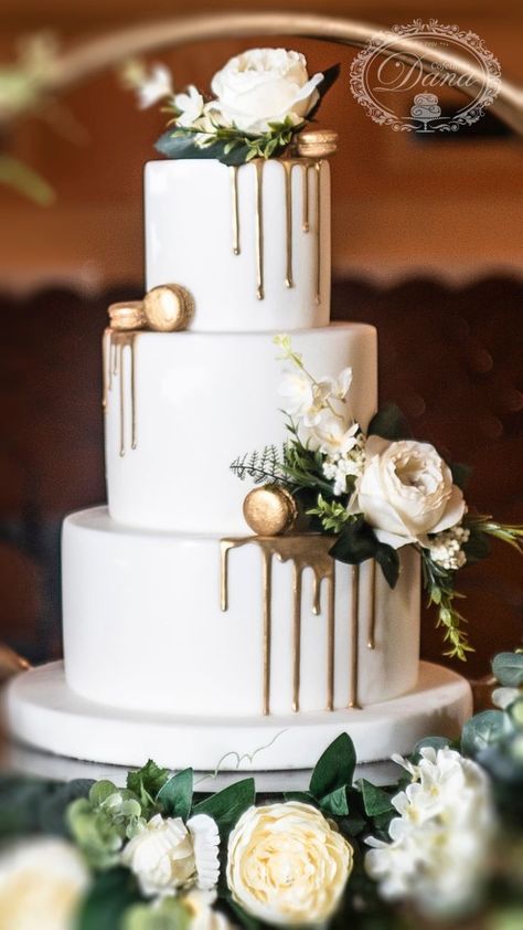 Gold Drip Wedding Cake With Flowers, White Gold Cake Wedding, Drip Wedding Cakes, Drip Wedding Cake Ideas, Olive Green Wedding Cake Ideas, White And Gold Wedding Cake Simple, Simple Wedding Cake White And Gold, Green Gold And White Wedding Cake, Wedding Cakes Greenery