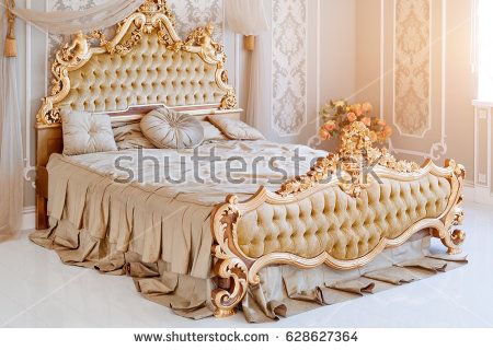 Luxury bedroom in light colors with golden furniture details. Big comfortable double royal bed in elegant classic interior Golden Bed, Luxury Bedroom Lighting, Wooden King Size Bed, Beautiful Bed Designs, Golden Furniture, Royal Bed, Design Ložnic, Luxury Bedroom Furniture, Wooden Bed Design