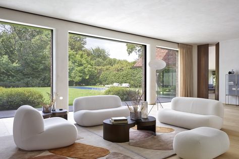 Puffy, plump designs have been everywhere of late. See the best trends to incorporate into your interiors today. Yabu Pushelberg, Ligne Roset, Cozy Fireplace, Fabric Armchairs, Low Tables, Higher Design, Home Trends, A Living Room, Settee