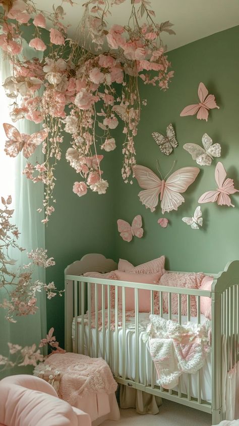 Chic gender-neutral nursery with green walls, butterfly decor, floral garland, and soft pastel colors, featuring a cozy baby Woodland Nursery Inspiration, Circle Crib Nursery, Flower Baby Girl Nursery, Baby Rooms Idea, Baby Girl Nursery Fairy Theme, Bright Green Nursery, Cute Girl Nursery Ideas, Baby Nursery Themes Girl, Fairy Core Nursery