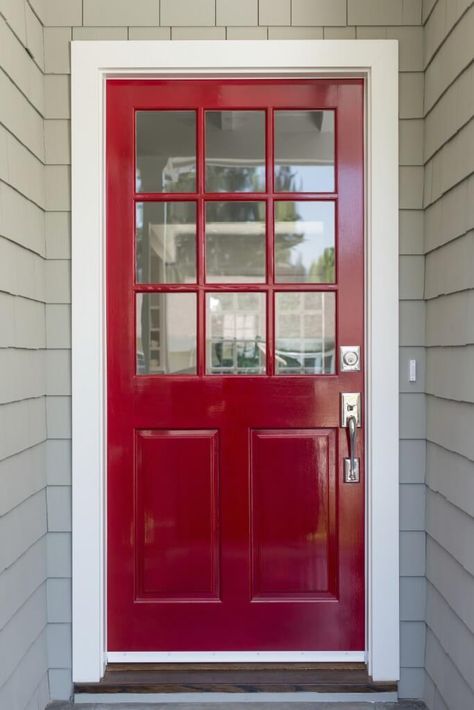 A very simple and contemporary front door with light gray siding and brushed nickel fixtures. The top half of the door is adorned by nine glass panels. Gray Siding, Front Door With Screen, Grey Siding, Red Front Door, Contemporary Front Doors, Front Door Entryway, Front Door Paint Colors, Black Front Doors, Modern Front Door