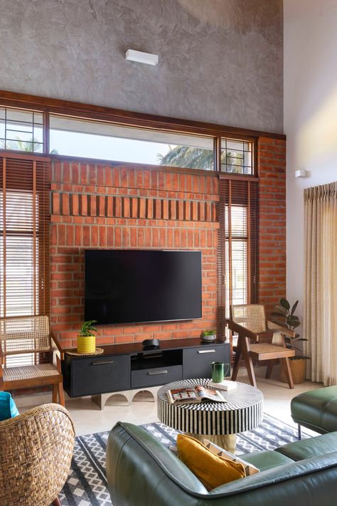 White walls and exposed brick highlight this Bangalore home's design | Architectural Digest India Brick Interior, Brick Cladding, Indian Home Design, Brick Architecture, Bungalow Design, Exposed Brick Walls, Tv Unit Design, Brick Design, Indian Home