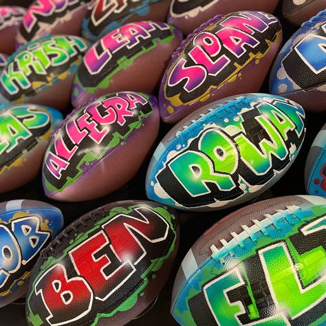 Custom football with a name hand-painted in airbrush Graffiti! These personalized sports gifts are perfect for team gifts, the coach, man caves, Father's Day gifts, senior night, business clients, or for sports theme party decor, centerpieces, party favor giveaways, & much more! Available in Sizes: Official/Regulation, Junior, & Pee Wee The personalized football includes ONE name in your choice of colors on ONE side of the ball. Black shadowing and white in-lining are included in every design. We also highlight the outside of the lettering using a coordinating color that you can choose yourself or have the artist choose. Additional add-ons can include a design theme to match your favorite team (cost varies).  Add-ons - https://www.etsy.com/artspotairbrush/listing/953357154/additional-artwo Senior Night Football Basket Ideas, Football Favors For Players, Senior Football Night Gifts, Football Homecoming Gifts For Boys, Football Player Gifts Ideas, Football End Of Season Gifts For Players, Youth Football Homecoming Ideas, Homecoming Gifts For Football Players, End Of Season Football Player Gifts