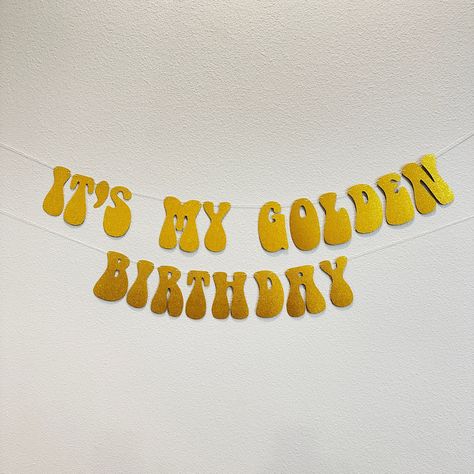 "Prepare to be delighted, this customizable It's My Golden Birthday banner is the perfect addition to your party decor!  ---OPTIONS--- > It's My Golden Birthday: Will include the phrase \"IT'S MY GOLDEN BIRTHDAY\".  Measures approximately 4' long and is adjustable by sliding the items on the string. > Custom Sign (with number of letters): Will contain your custom message only. Please be sure to write a personalization with the message you would like.  --- DETAILS --- > Made with card stock paper. > Each letters is 5\" tall and most letters are approximately 3\" wide. > All banners are pre-strung on a thin cotton string. > All letters are not attached to the string so they can slide to adjust the size/look of the banner. Looking for more birthday options? Click here: https://www.etsy.com/sh Golden Birthday Birthday Cake, 26 Golden Birthday Party Ideas, Golden 19th Birthday, Golden Birthday Party Ideas For Adults, Gold Party Decor, Golden 30th Birthday Ideas, 2nd Golden Birthday, Golden Birthday Aesthetic, Golden Bday