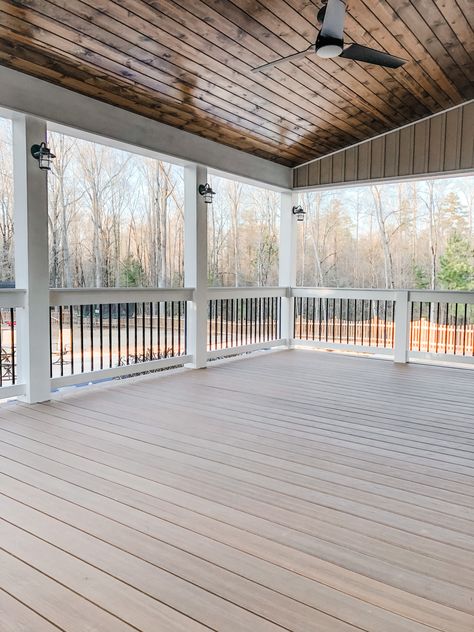 Covered porch with white columns and black spindles. The wood stain is provincial. We used trex boards for the floor. Trex Porch, Black Spindles, Southern Porch, Small Patio Design, White Porch, Ranch House Exterior, Southern Porches, Porch Addition, Patio Deck Designs