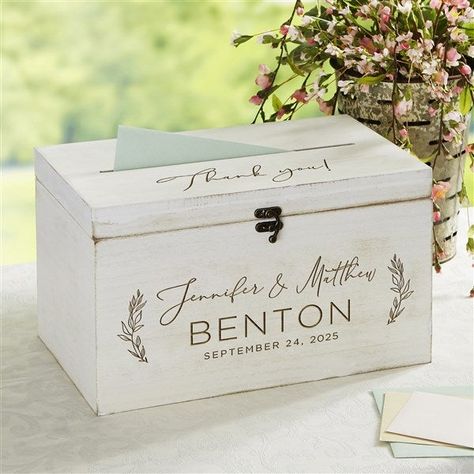 * Front of box is engraved with couples names, last name and 1 line message * Top of box is engraved with 1 line message  * Features latch lock to keep box closed * Opening on box lid allows for guests to easily deposit their greeting card * Felt lined interior * Measures 8 L X 13.5 W X 8 H * Holds approx. 60-100 cards * Constructed of MDF whitewash wood * Wipe clean * Imported Our Elegant Couple Engraved Wooden Wedding Keepsake Card Box is the perfect gift for any couple or bride-to-be. Their special day will be a day to remember with this keepsake box. Advice Box Wedding, Wedding Advice Box, Advice Box, Wedding Luncheon, Elegant Couple, Whitewash Wood, Card Box Wedding, Cute Wedding Ideas, A Day To Remember