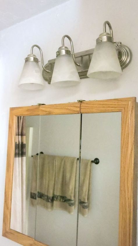 The hottest way to update your boring bathroom light is here! Spray Painting Light Fixtures, Rustic Bathroom Light Fixtures, Diy Vanity Lights, Light Fixture Makeover, Glass Light Globes, Bathroom Lighting Diy, Painting Light Fixtures, Vanity Light Shade, Rustic Bathroom Lighting