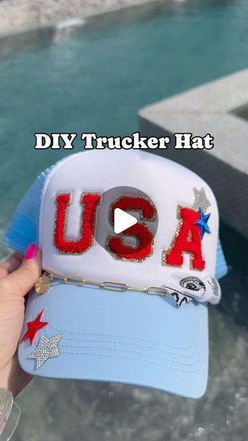 Amber Vestal on Instagram: "🇺🇸Comment USA for links to be festive for Memorial Day! 🇺🇸 I purchased this trucker hat with USA already on it and added a few things for a custom look. SO FUN for kids too!  If a link is not sent to your DM head straight to my LTK wifeonadime for for the links! My automation service is glitching today! 💀  #truckerhats #usa #memorialday #patriotic #murica #🇺🇸  #ltkfashion #ltkfestival #ltkseasonal @shop.ltk  https://liketk.it/4GOKp" Patriotic Trucker Hat, How To Make Trucker Hats, Trucker Patch Hat Ideas, Iron On Trucker Hat Diy, Usa Trucker Hat, 4th Of July Trucker Hats, Painted Trucker Hats Diy, Trucker Hats With Patches Diy, Diy Trucker Hat With Patches