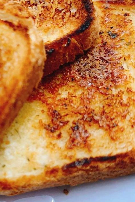 This copycat Sizzler cheese toast is a quick add-on to round out any meal. Spread a quick cheese butter onto bread, toast in a hot skillet, and it's ready in about a minute. Making Croutons, Sizzler Cheese Toast, How To Make Croutons, Cheese Toast Recipe, Homemade Egg Noodles, Savoury Snacks, Garlic Cheese Bread, Southern Recipes Soul Food, Homemade Crackers