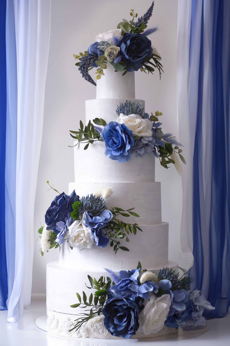 Enhance your wedding cake with our Stunning Royal & Dark Blue Floral Cake Topper Set. This impressive 4-piece floral arrangement is designed to elevate your cake with striking dark and royal blue tones, perfect for adding sophistication and style to any wedding or special occasion. Crafted from high-quality artificial flowers, this set offers a luxurious look that will captivate your guests and complement a wide range of wedding themes, from classic and elegant to bold and modern. Royal Blue Wedding Cake Ideas, Royal Blue And White Wedding Cake, Dark Blue Wedding Cake, Wedding Cake Dark Blue, Sapphire Wedding Theme, Cake With Blue Flowers, Royal Blue Wedding Cake, Blue Floral Cake, Ocean Wedding Cake