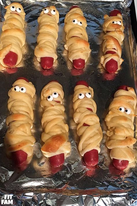 Mummy pigs in a blanket is the perfect party food for Halloween! We love Halloween themed foods. They add such a fun touch to the night! Easy Spooky Food, Halloween Traditions For Kids, Halloween Themed Food For Kids, Halloween Theme Dinner, Halloween Foods For Kids, Cute Halloween Food Ideas, Halloween Fun Food, Halloween Fun For Kids, Halloween Appetizers For Adults