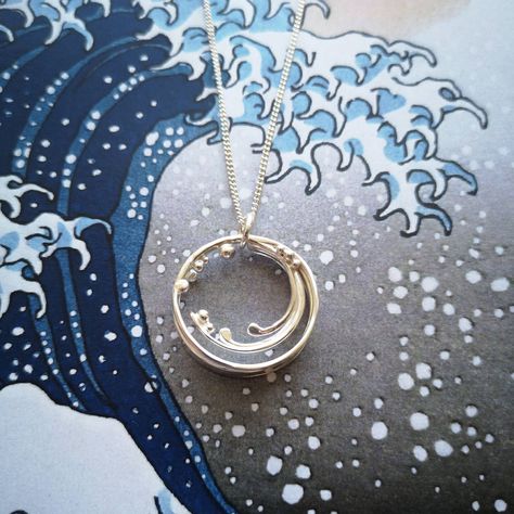 Recycled silver crashing barrel wave circular necklace with silver ball detail, on background of blue, white and grey wave image Jewelry With Meaning, Textured Layers, Sea Jewelry, Handmade Silver Jewellery, Ocean Surf, Wave Necklace, Katsushika Hokusai, Magical Jewelry, Silver Jewelry Design