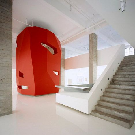 This clever faceted red volume in a Shanghai office, designed by 3Gatti Architecture Studio of Rome and Shanghai, houses two meeting rooms and a cafe. Emphasis In Architecture, Emphasis In Interior Design, Luxury Stairs, Concrete Interiors, Colour Architecture, Hospital Interior, Luxury Office, Office Furniture Accessories, Principles Of Design