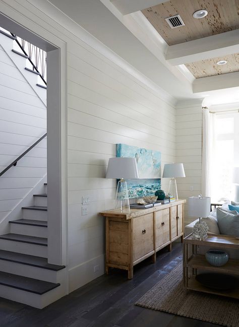 I love the contrast the dark hardwood flooring creates against the white shiplap walls. white-shiplap-walls-with-dark-stained-floors Geoff Chick & Associates Beach House Decorating, Florida Beach House, White Shiplap Wall, Hardwood Floors Dark, House Of Turquoise, White Shiplap, Floor And Decor, Beach House Interior, Beach House Design