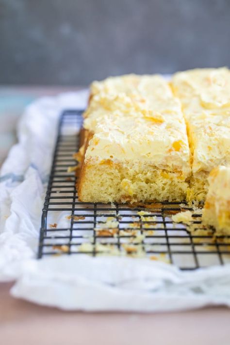 Squares of Pig Pickin' Cake on a black cooling rack. Pig Lickin Good Cake, Pig Picking Cake, Pig Pickin Cake Recipe, Pig Pickin Cake, Low Sugar Cakes, Pig Pickin, Cake Pineapple, Hot Milk Cake, Picnic Cake