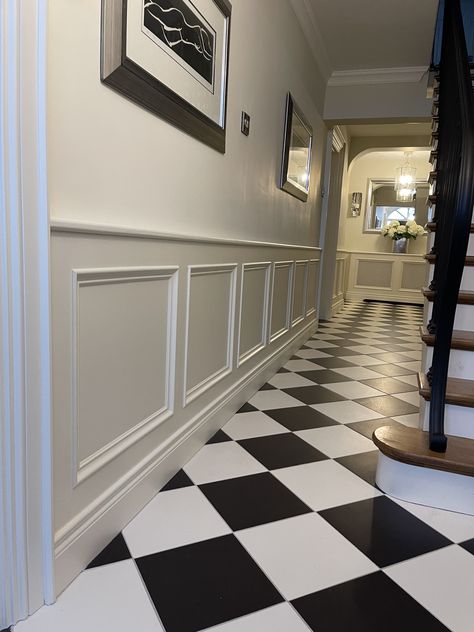 This hallway was drab and didn’t suit the house when we bought it. It had an inner door and under stair cupboard that made it all very cramped. We replaced the rotting stairs with a new 15 riser staircase with oak treads and custom made a stunning metal banister. The new wainscoting and black white cathedral floor tiles are incredible with the whole space painted Farrow & Ball Slipper Satin. Black And White Hallway Floor, Black And White Tiled Hallway, Black And White Tile Hallway, Black And White Tiles Hallway, Checkered Hallway, Hallway Wainscotting, Lambriseringen Gang, Hallway Aesthetic, Victorian Hallway Tiles