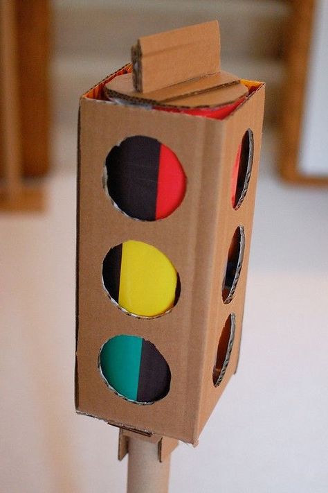 How to make a traffic light out of cardboard boxes...love this. Also how to make cardboard car, gas tank, etc. Fun site. by KarlaChS Cardboard Car, Ikat Bag, Cardboard Toys, Seasonal Crafts, Dramatic Play, Traffic Light, Cardboard Crafts, Diy Toys, Cardboard Box