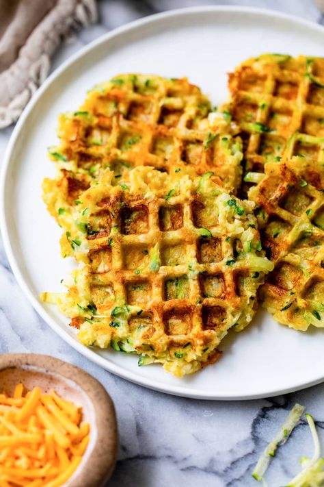 Dust off that waffle iron and make these zucchini waffles! It’s easy, super delicious, and a great way to use summer zucchini. #zucchini #waffle #sidedish #vegetarian #healthyrecipes #weightwatcherrecipes Zucchini Waffles, Zucchini Pancakes, Waffle Ingredients, Summer Zucchini, Waffle Maker Recipes, Savory Waffles, Easy Zucchini, Skinny Taste Recipes, Waffle Iron