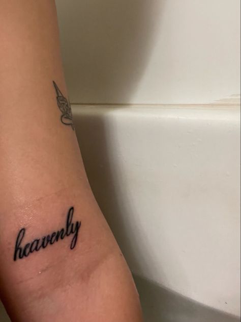 Heavenly Tattoos Word, Heavenly Angel Tattoo, Baddie Mini Tattoos, Heavenly Tattoos Women, Tatoos About God, Heaven Quotes Tattoos, One Of None Tattoo, Angel Energy Tattoo Cursive, Heavenly Tattoo Word