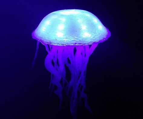 How to Make a Glowing Jellyfish (out of hot glue and LED strips) from Instructables Glowing Jellyfish, Jellyfish Lantern, Fire Crafts, Diy Jellyfish, Diy Jelly, Glow Fish, Jellyfish Decorations, Jellyfish Light, Jellyfish Lamp