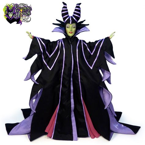 This plastic and vinyl Maleficent doll is inspired by her appearance in Walt Disney’s Sleeping Beauty animated film (1959), and released to celebrate its 50th Anniversary. Green vinyl doll head features a custom sculpt and intricate facial details that are first imprinted — for the sclera (white of the eye), pupil, eyebrows and lips — then the iris, eye shadow, eyeliner, lashes, and eyebrow details are hand-painted. Blush is applied first with airbrush and hand-detailed. Black saran rooted ... Evil Queen Cosplay, Sleeping Beauty Characters, Eye Pupil, Eyeliner Lashes, Eye Shadow Eyeliner, Iris Eye, Demon Queen, Queen Cosplay, Black Velvet Shoes