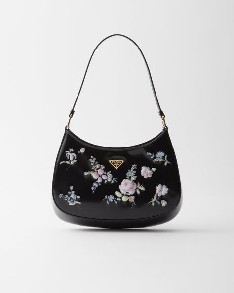 A reinterpretation of an iconic style of the '90s, the Prada Cleo bag is reinterpreted with an embossed porcelain-effect floral print, a precious touch inspired by the elegance of the past that enhances the sleek silhouette. Cute Shoulder Bag, Prada Bags, Black Prada Bag, Mini Designer Bags, Ballerina Slippers, Luggage Bags Travel, Messenger Bag Backpack, Mens Travel Bag, Prada Handbags