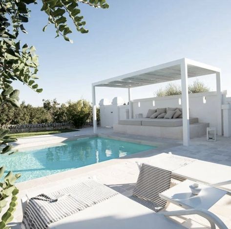 Poolside pergola. #Poolside #pergola #purewhite #pool #swimmingpool #sunloungers #seating #exterior #minimalism #design #monochrome #masseria #lamia #lighting #puglia #lifestyle #architecture #style #cabana Pool Area Australia, White Pool Cabana, Mediterranean Pool Area, Pergola Poolside, Poolside Pergola, Pool Gazebo Ideas Cabanas, Outdoor Entertaining Area Australian, Pool Pergola Ideas Cabanas, Pool Area Ideas Australia