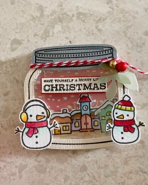 Eileen on Instagram: "Mini shaker card. Instead of the snow globe @lawnfawn, I decided to use the jar to create this shaker card. Love the small village houses and snowman ⛄️. Got my daughter to help in the creation of the short video. Great thanks to her and love her. 😘 #handmade #handmadecards #madewithlove #cardmaker #cardmaking #cardmakersofinstagram #papercrafting #paper #papercraft #diecut #stamps #stamping #diecutting #clearstamps #diecutting #carddesign #cardmakinghobby #cardmakingideas #handmadegreetingcards #shakercards #lawnfawn #lawnfawnatics #tombowdualbrushpens #手工卡 #手工卡片 #lawnfawnpaper #lawnfawndies" Lawn Fawn Cards, Small Village, The Jar, Shaker Cards, Village Houses, Lawn Fawn, Snow Globe, Card Maker, Greeting Cards Handmade