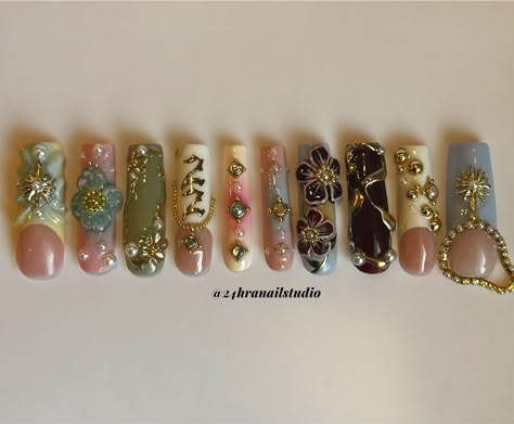 Your favorite nail tech turned 22✨🌸☀️✨ Custom birthday set for myself @zahrazshahh Here’s a rundown of the inspiration behind this set: Zahra in Arabic means flower so i based it around 3D flowers, I was born on the summer solstice so i added some gold sun charms, and my birth stone is a pearl so i added a few for embellishment. Everything is hand sculpted and painted by me ✨ #njnailtech #bestofnjbeauty #njnails #gelxnails #custompressons #custombirthdaynails #birthdaynails #nycnails #n... I <3 Me Nails, Long Junk Nails With Charms, 22 Nails Birthday, Gold Nail Charms, Nails With Numbers On Them, Nail Page Name Ideas, Arabic Nails, Gold Charm Nails, Nail With Charms