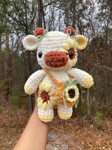 Crochet Sunflower Cow Plushie w/ Drawstring Flower Bag DIY crochet toys #diycrochettoys #crochet #crochettoy #crochettoys 3.166 Sunflower Cow Amigurumi, Sunflower Cow Crochet Pattern, Fun Crochet Projects Creative, Embroidered Plushies, Crochet Sunflower Cow, Crochet Plushie Ideas, Cow Crochet Plushie, Crochet Cows, Crochet Sunflower Bag