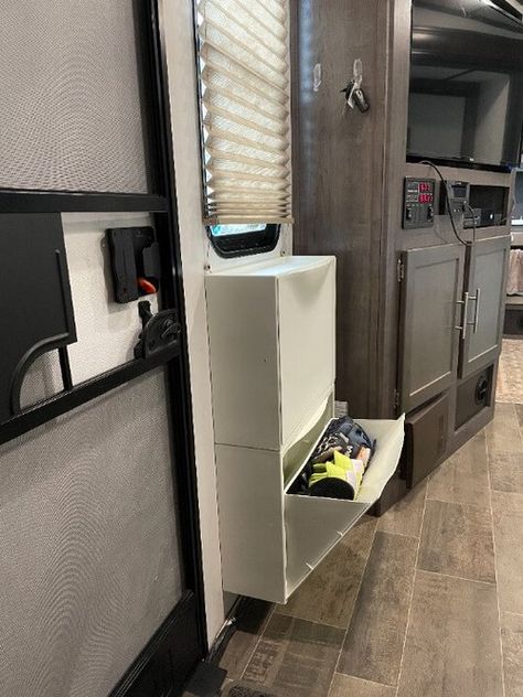 Camper Hidden Storage, Rv Storage Clothes, Camper Pet Ideas, Shoe Storage Rv Travel Trailers, Rv Boot Storage Ideas, Under Camper Storage, Rv Ikea Storage, Rv Living Storage Ideas, Shoe Storage In Camper