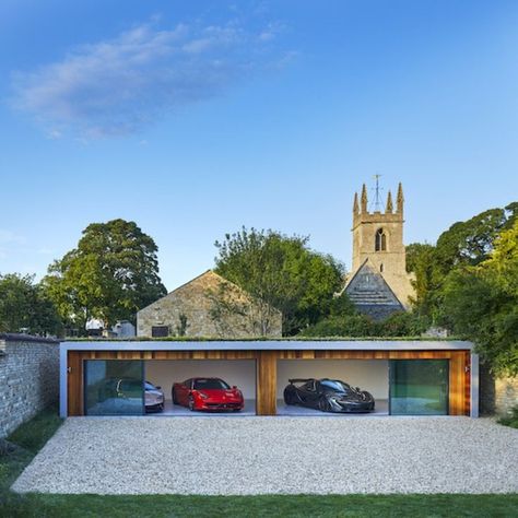 a wide single Storey home garage with sliding glass doors Large Sliding Glass Doors, House In England, Garage Extension, Timber Garage, Dream House Aesthetic, Garage Design Interior, 5 Car Garage, Luxury Car Garage, Glass Garage Door