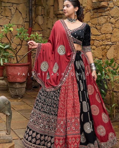 🖤❤️ Embrace the vibrant spirit of Gujarat with our Black & Maroon Ajarakh Designer Navratri Chaniya Choli! ❤️🖤 This exquisite ensemble features timeless Ajarakh prints, intricate multi-color embroidery, mirror work, and traditional motifs. The matching embroidered blouse and maroon dupatta complete this captivating look, perfect for making a statement this Navratri. ✨ Shop now at Palkhi Fashion and experience the magic of Ajarakh! ✨ Learn More :- https://palkhi.us/link #PalkhiFashion #Nav... Lehenga With Mirror Work, Navratri Blouse, Dandiya Night, Gamthi Work, Navratri Outfits, Maroon Dupatta, Kutchi Work, Palkhi Fashion, Navratri Lehenga